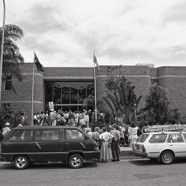 Protestors meet outside the City Council's Administration building, late 1991