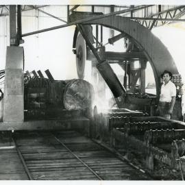 Log going through the Isles Forge breaking down saw auto trailer out