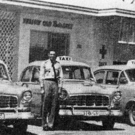 Radio-controlled yellow taxi cabs, December 1962