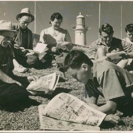 South Solitary Island lighthouse families devour the post and newspapers, 1946