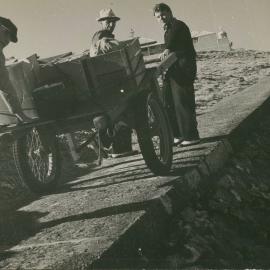Hauling the supply cart from the gantry to the cottages on South Solitary Island, 1946