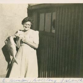 Mrs Ella Duncan with Good Friday dinner on South Solitary Island, 1946