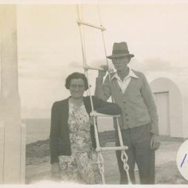 Jim and Ella Duncan at the flagpole on South Solitary Island, 1946