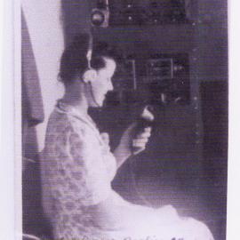 Beryl Duncan with the new Bendix radio on South Solitary Island, 5 December 1947