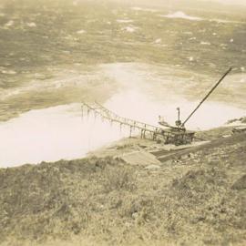 South Solitary Island jetty with crane above a rough sea, 1946