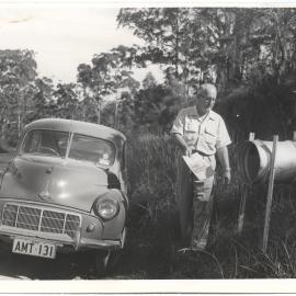 Jack Gerard putting Tasma Theatre flyers in mailboxes c.1950
