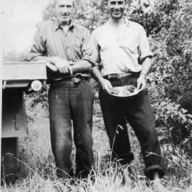 Chris Lewthwaite snr and jnr with pumpkin scones at Englands Road, 1950