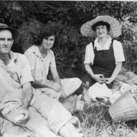 Tom Bishop with Noelene Lewthwaite and Jessica Hill in the pumpkin patch, 1950