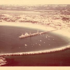 Aerial view of the jetty and northern breakwall in front of the airport, late 1970s
