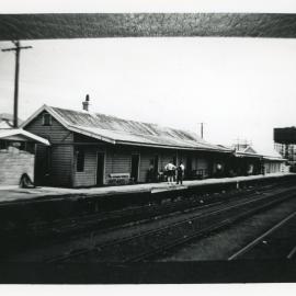 Ramshackle railway station and water tower, 1960s