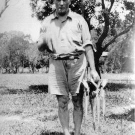George Blakey with fish catch, 1933