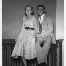 Jim Worland and friend sitting on a stair rail in the old surf club