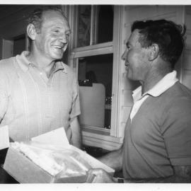 Jim Worland and Arthur Payne at a presentation held in the Deep Sea Fishing Club, 1970
