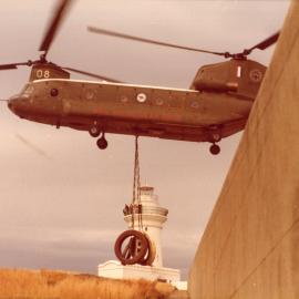A Chinook helicopter lifts part of the South Solitary Island light, 7 September 1977