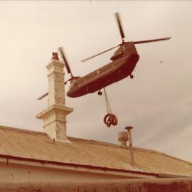 A Chinook helicopter lifts part of the South Solitary Island light, 7 September 1977