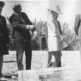The Queen admires the felled timber, April 1970