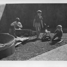 Fixing a go-cart on South Solitary Island, early 1970s