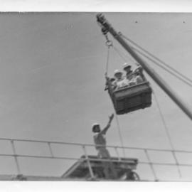 Transfer by crane and basket at South Solitary Island, early 1970s