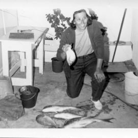 Pat Ross with her catch after a night of fishing, early 1970s