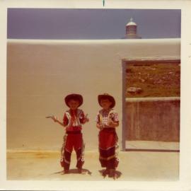 Mick and John Ross play cowboys on South Solitary Island, early 1970s
