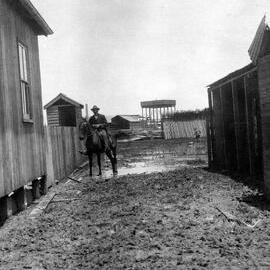 Muddy public laneway in the Jetty village
