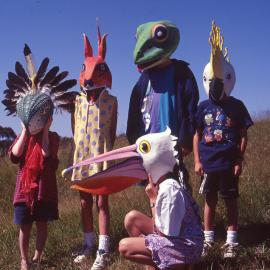 A group of children wearing masks