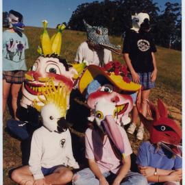 A large group of children wearing masks, 1996
