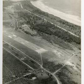 Aerial view of the Coffs Harbour airstrip looking north-east over Corambirra Point, 19 October 1982