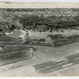 Aerial view of the Coffs Harbour airstrip looking east over Boambee Beach, 19 October 1982