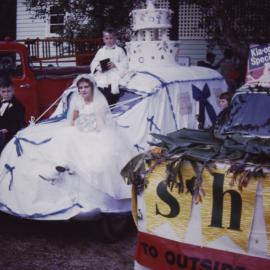 A wedding cake float in the Sawtell street parade, c.1960