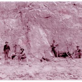 Workmen at the quarry dynamiting rocks for north and south wall construction