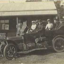 Picture postcard of passengers in a Coastal Transport Co. Ltd car, c. 1910