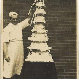 Cake and baker at Police Depot, Sydney, Christmas 1927