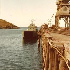 Naval landing vessel moored at Coffs Harbour Jetty, 1970s