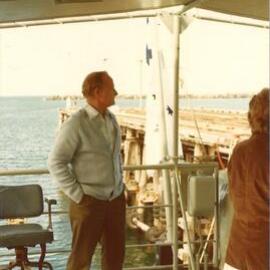 Man aboard a naval boat, Coffs Harbour Jetty, 1970s