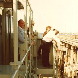 Man aboard a naval boat, Coffs Harbour Jetty, 1970s