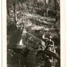 Photograph of two men on a tractor
