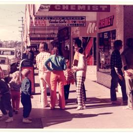 People on footpath, High Street, Coffs Harbour, c. 1980s