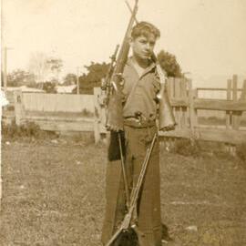 Donald Jack Glynn posing with firearms, 1935