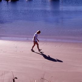 Person walking along Marina beach area