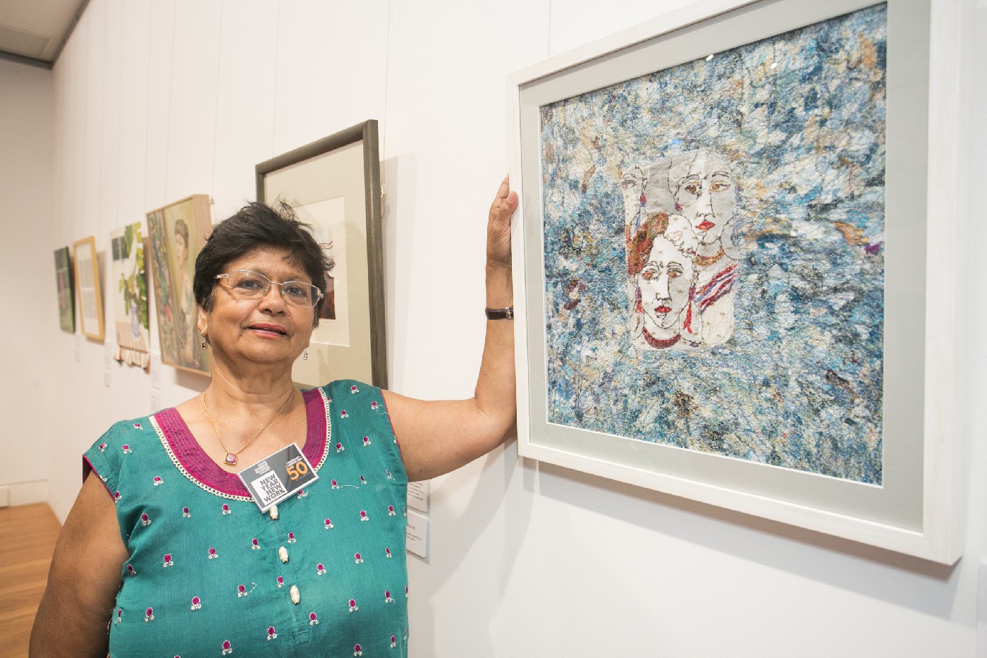 Yvonne Quadros at the New Year, New Work exhibition with her piece 'Connecting with stitch'. Photographed by Jamie Williams.